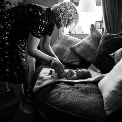 Mother changing newborn at home in Jedburgh Scottish Borders family photography session